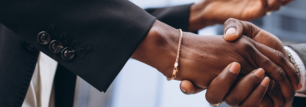 Business partnership handshake